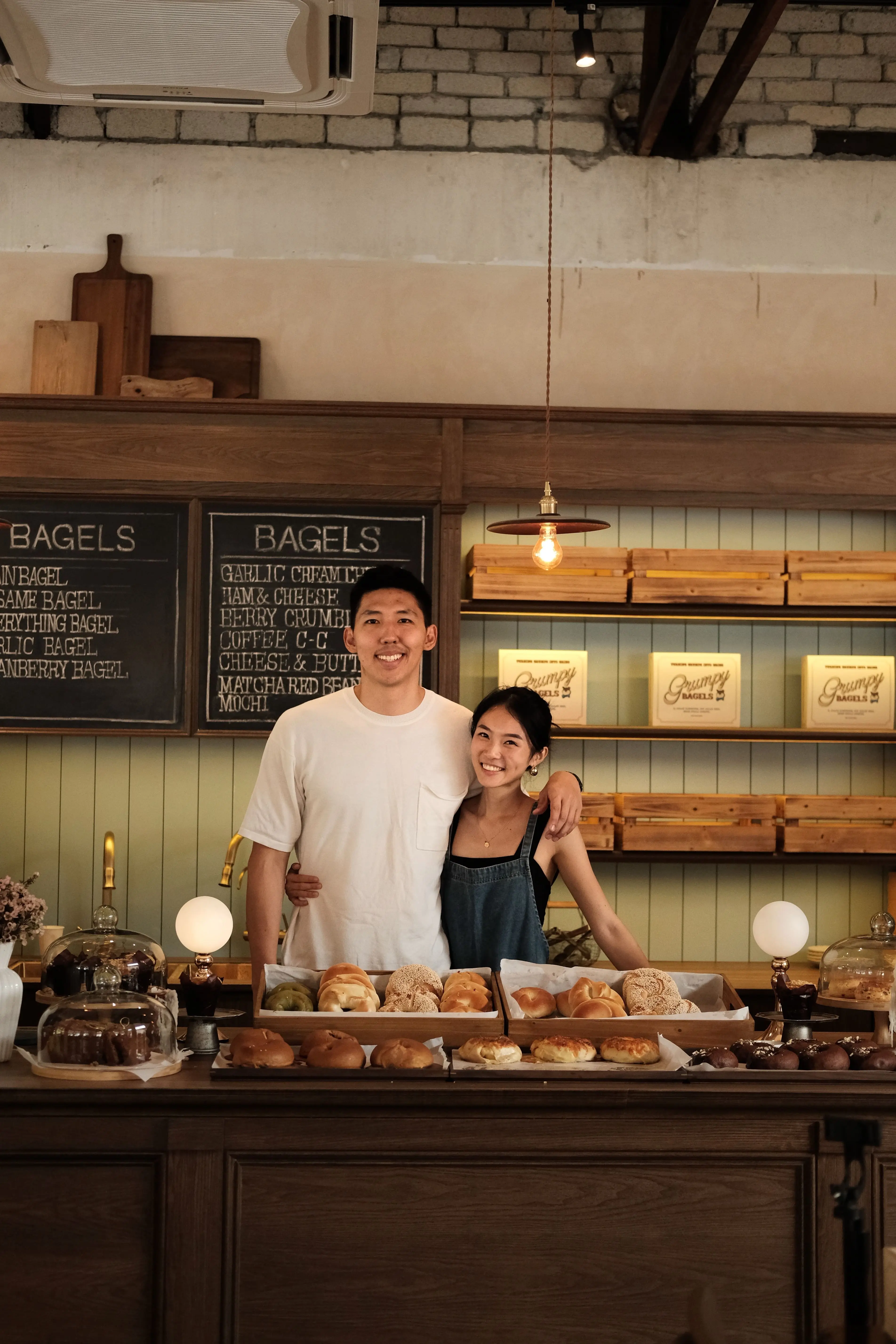 Claire Tan, founder of Grumpy Bagels KL, with her husband Ivan — the couple behind the viral bagel café